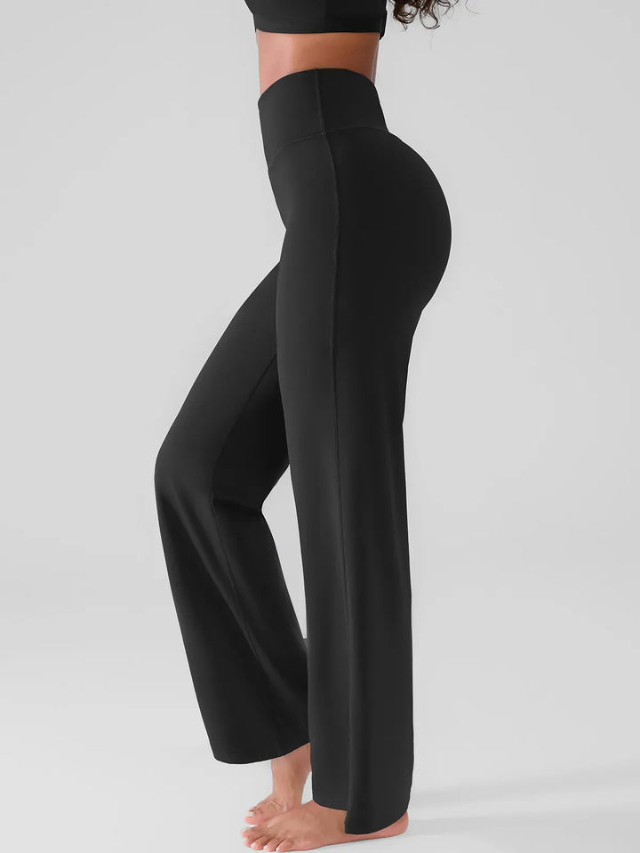 A model wearing a BRXL® Butt Lift Wide Leg Workout Pants in