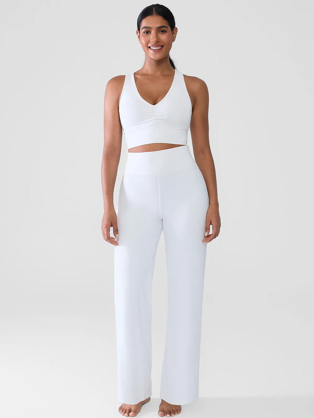 A model wearing a BRXL® Butt Lift Wide Leg Workout Pants in