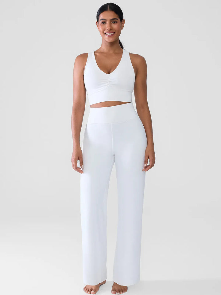 A model wearing a BRXL® Butt Lift Wide Leg Workout Pants in