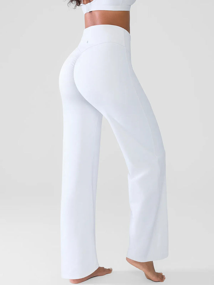 A model wearing a BRXL® Butt Lift Wide Leg Workout Pants in