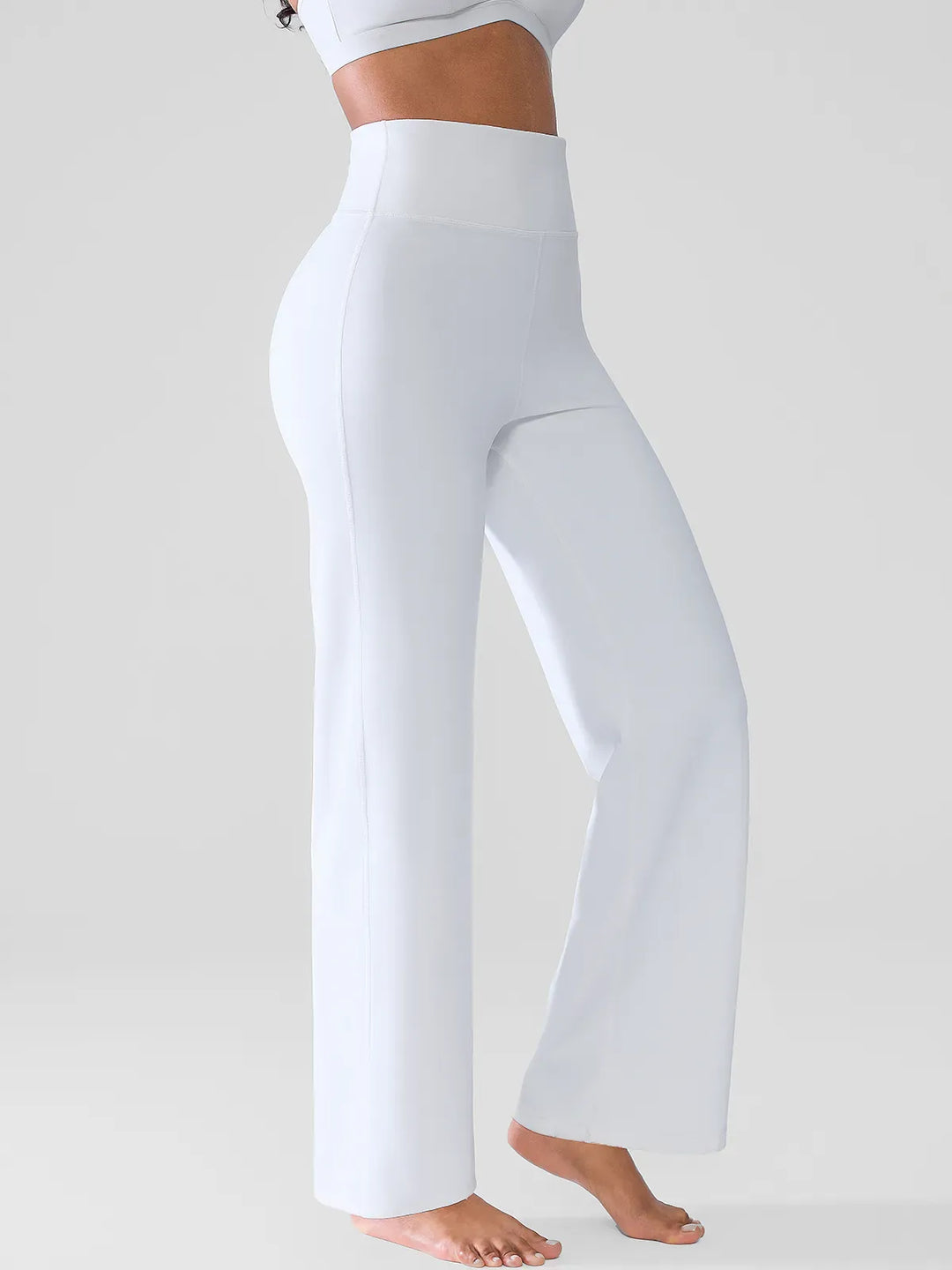 A model wearing a BRXL® Butt Lift Wide Leg Workout Pants in