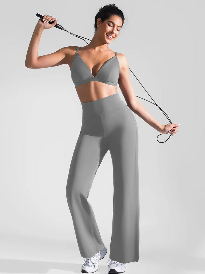A model wearing a BRXL® Butt Lift Wide Leg Workout Pants in