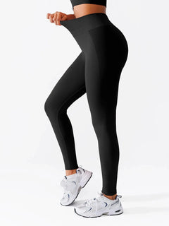 A model wearing a BRXL® Butt Lifting Seamless Bra Scrunch Leggings Set Leggings / Black / XS