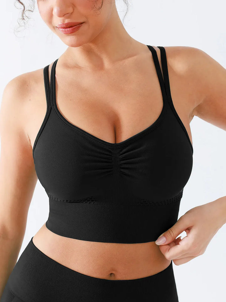 A model wearing a BRXL® Butt Lifting Seamless Bra Scrunch Leggings Set in