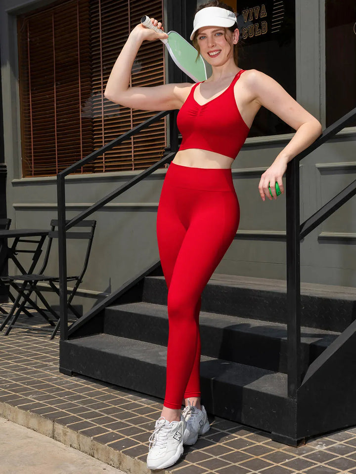A model wearing a BRXL® Butt Lifting Seamless Bra Scrunch Leggings Set in Set / Red / XS