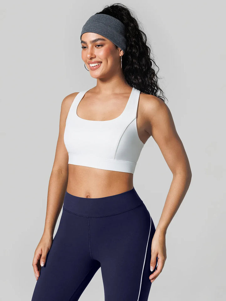 A model wearing a BRXL® Contrast Color Wide Strap Bra Tummy Control Leggings Set in