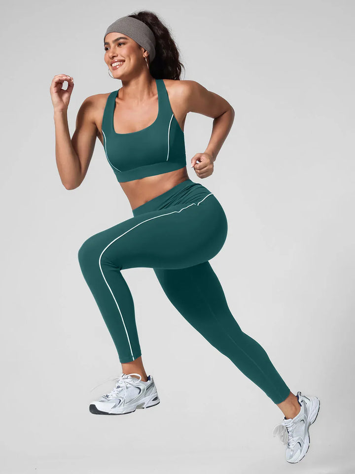 A model wearing a BRXL® Contrast Color Wide Strap Bra Tummy Control Leggings Set
