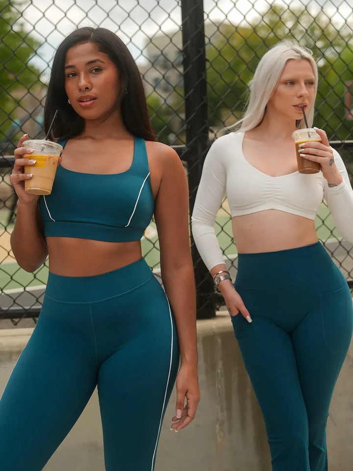 A model wearing a BRXL® Contrast Color Wide Strap Bra Tummy Control Leggings Set in