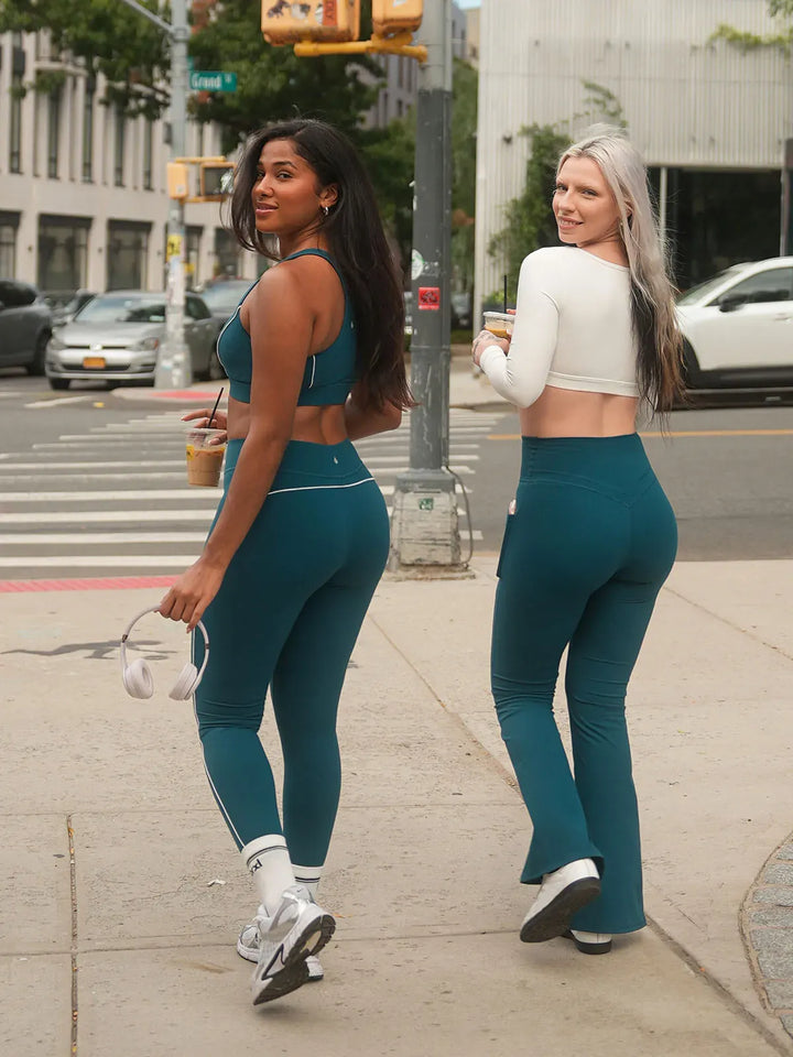A model wearing a BRXL® Contrast Color Wide Strap Bra Tummy Control Leggings Set
