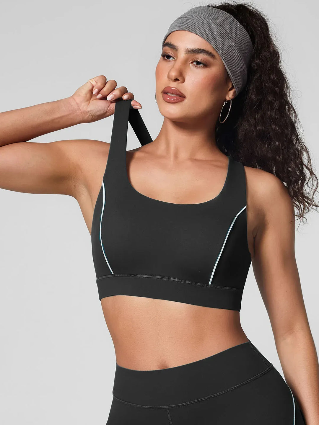 A model wearing a BRXL® Contrast Color Wide Strap Bra Tummy Control Leggings Set in Bra / Black / XS