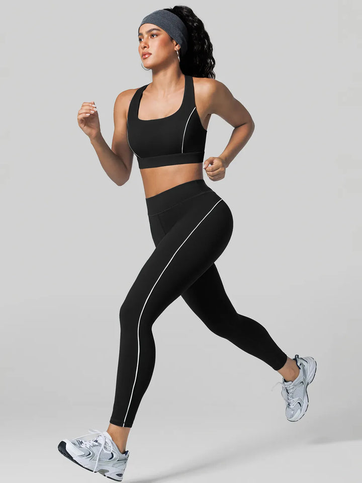 A model wearing a BRXL® Contrast Color Wide Strap Bra Tummy Control Leggings Set Set / Black / XS