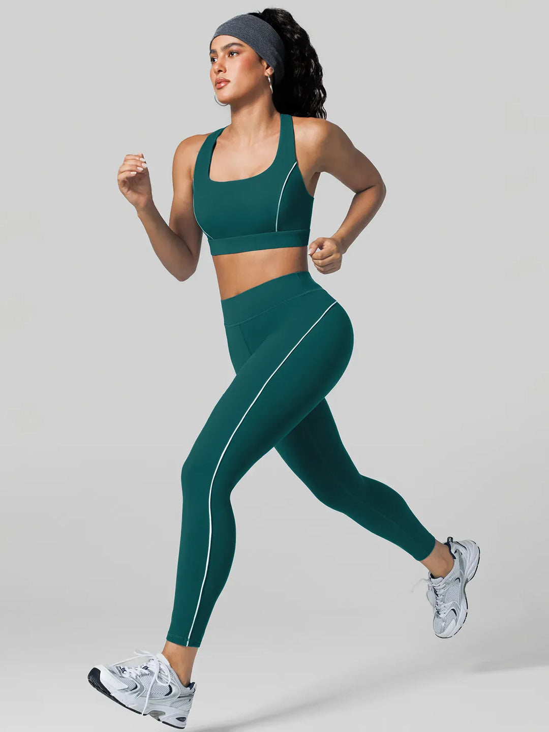 A model wearing a BRXL® Contrast Color Wide Strap Bra Tummy Control Leggings Set Set / Green / XS