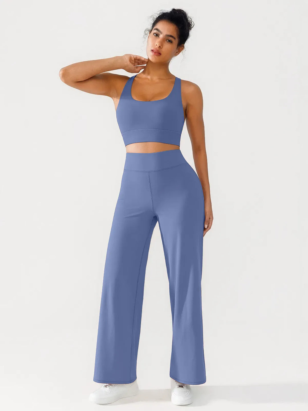 A model wearing a BRXL® Criss Cross Strappy Yoga Sports Bra in