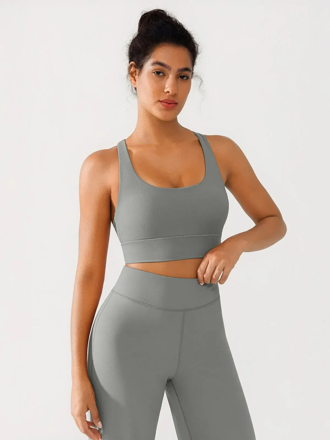 A model wearing a BRXL® Criss Cross Strappy Yoga Sports Bra