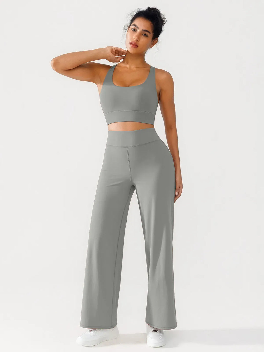 A model wearing a BRXL® Criss Cross Strappy Yoga Sports Bra