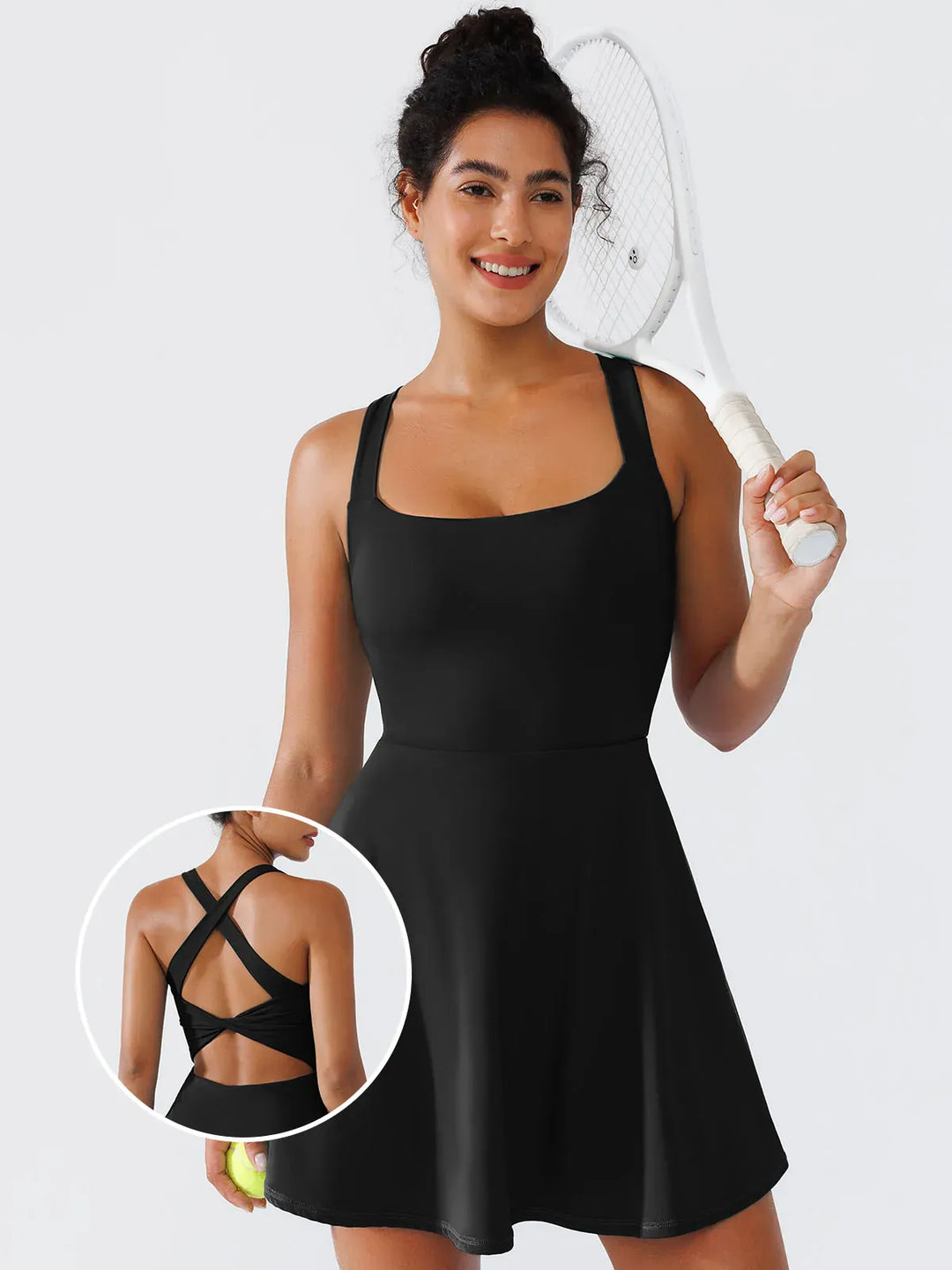 A model wearing a BRXL® CrissCross Back Sun Protection Tennis Dress
