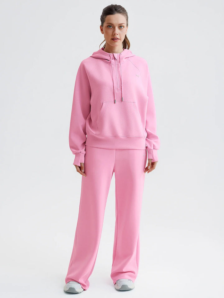 A model wearing a BRXL® Cropped Half-Zip Pullover Comfort Hoodie