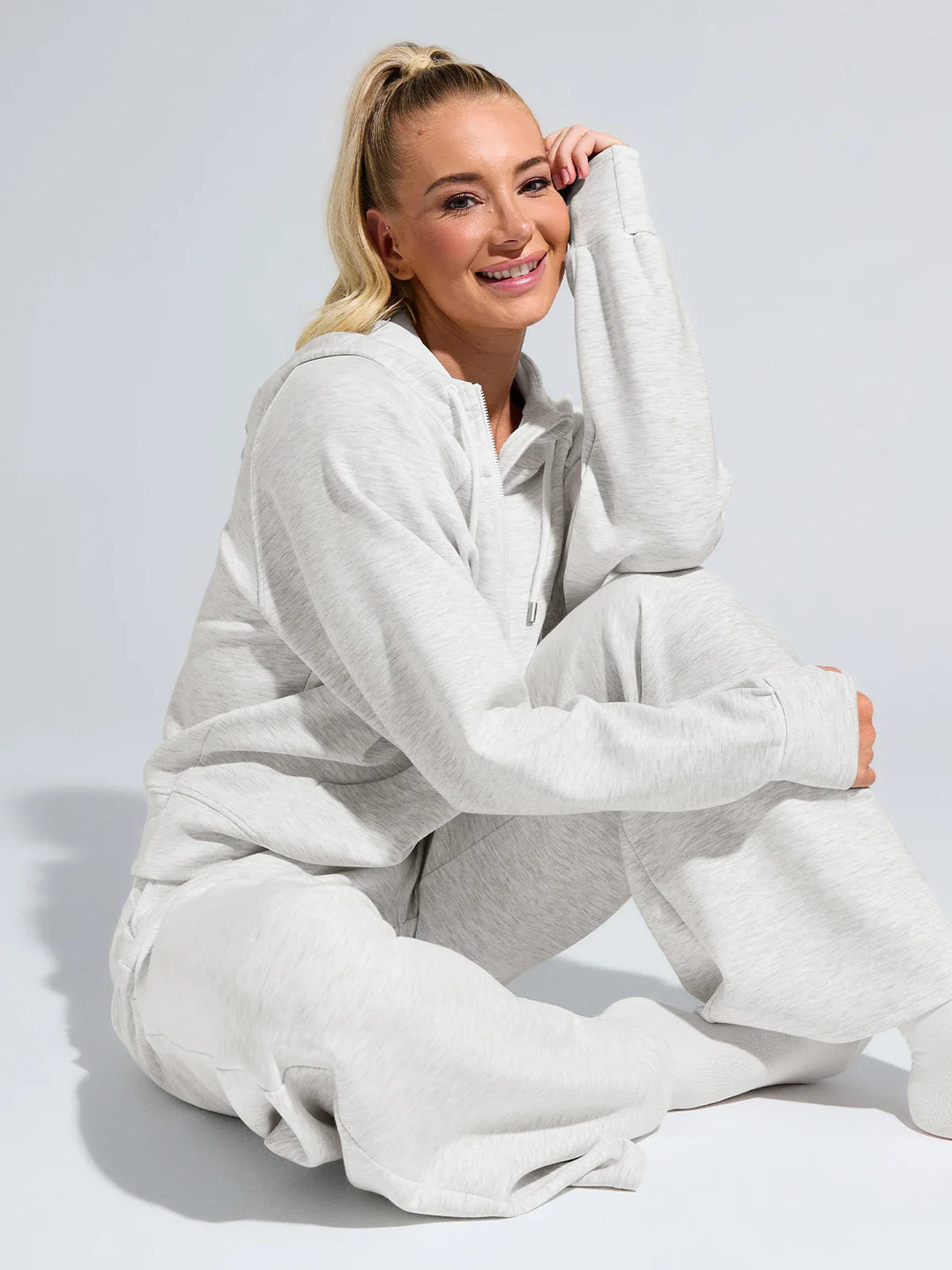 A model wearing a BRXL® Cropped Half-Zip Pullover Comfort Hoodie