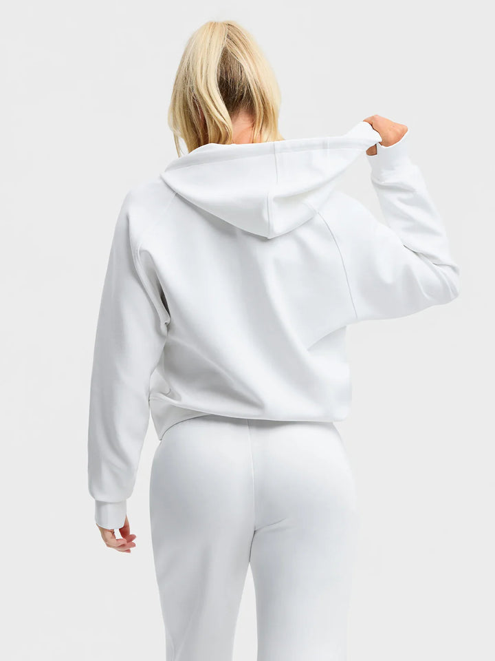 A model wearing a BRXL® Cropped Half-Zip Pullover Comfort Hoodie