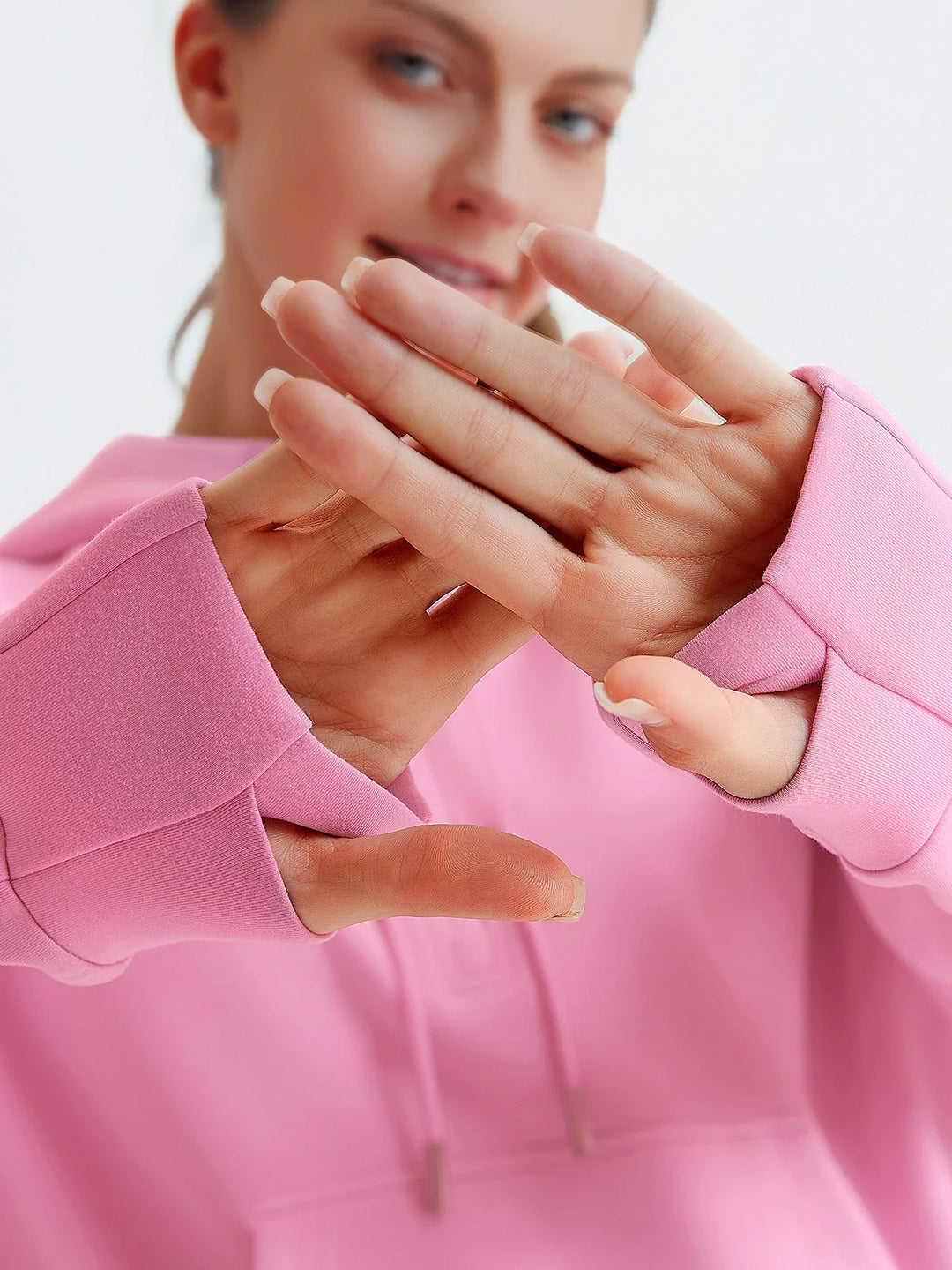 A model wearing a BRXL® Cropped Half-Zip Pullover Comfort Hoodie