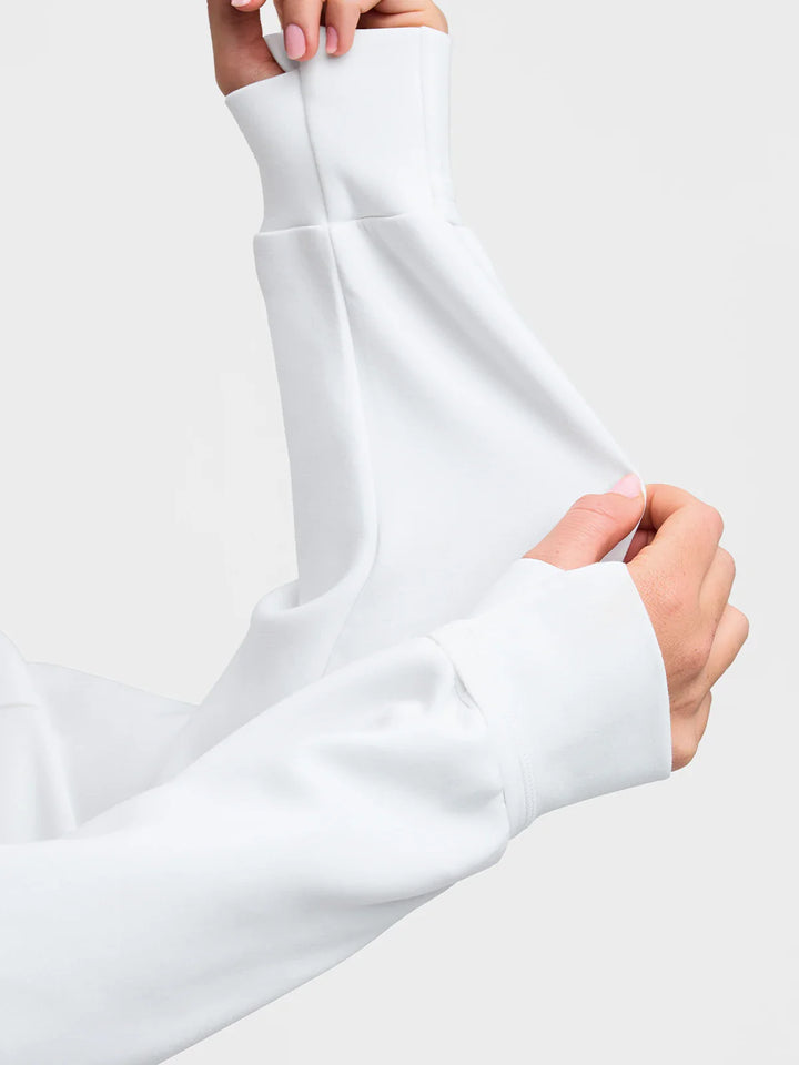 A model wearing a BRXL® Cropped Half-Zip Pullover Comfort Hoodie