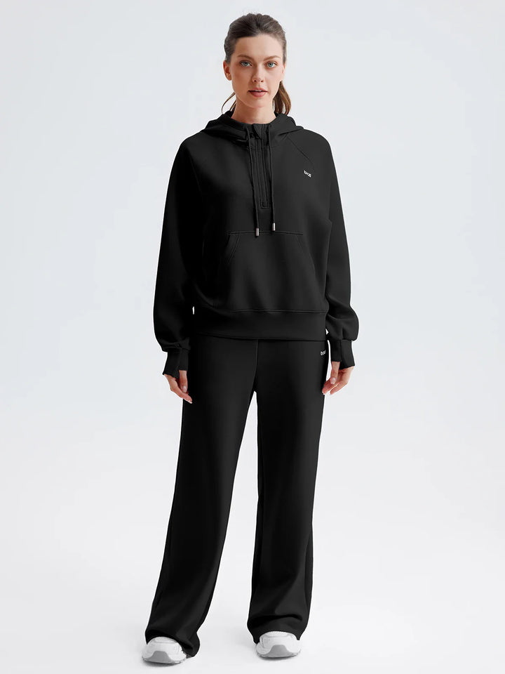 A model wearing a BRXL® Cropped Half-Zip Pullover Comfort Hoodie