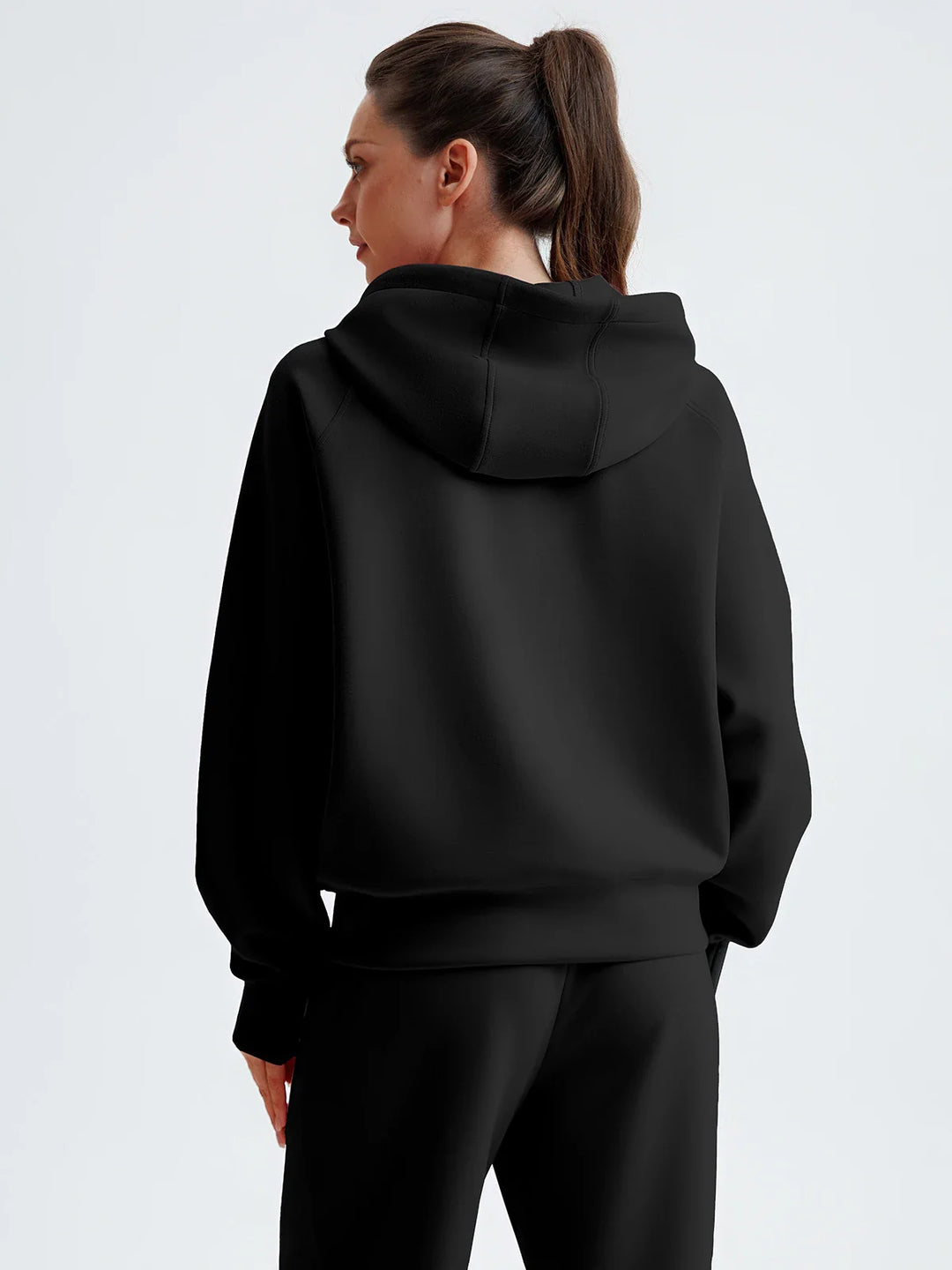 A model wearing a BRXL® Cropped Half-Zip Pullover Comfort Hoodie