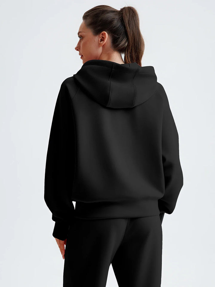 A model wearing a BRXL® Cropped Half-Zip Pullover Comfort Hoodie