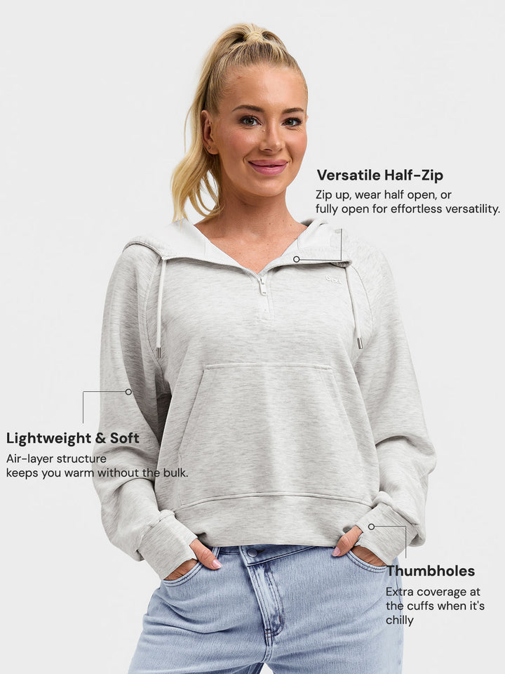 A model wearing a BRXL® Cropped Half-Zip Pullover Comfort Hoodie