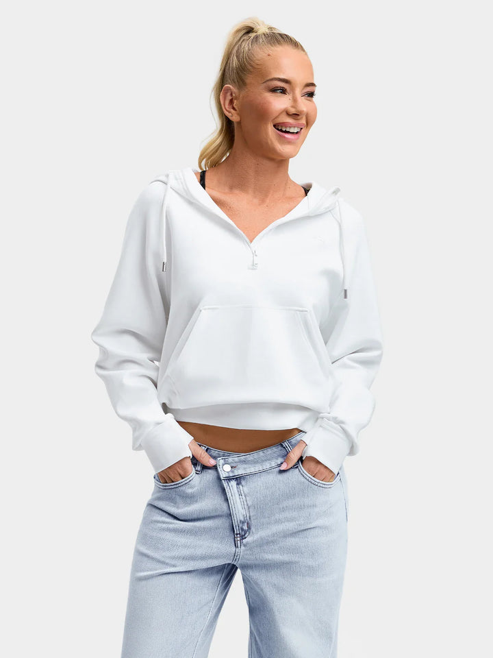 A model wearing a BRXL® Cropped Half-Zip Pullover Comfort Hoodie White / XS