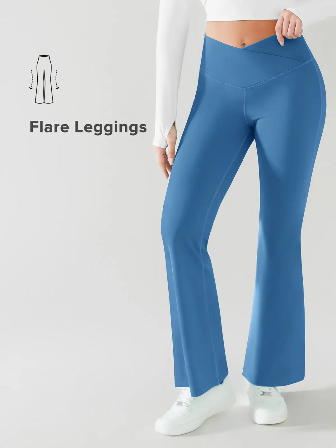 A model wearing a BRXL® Crossover Flared Yoga Pants in