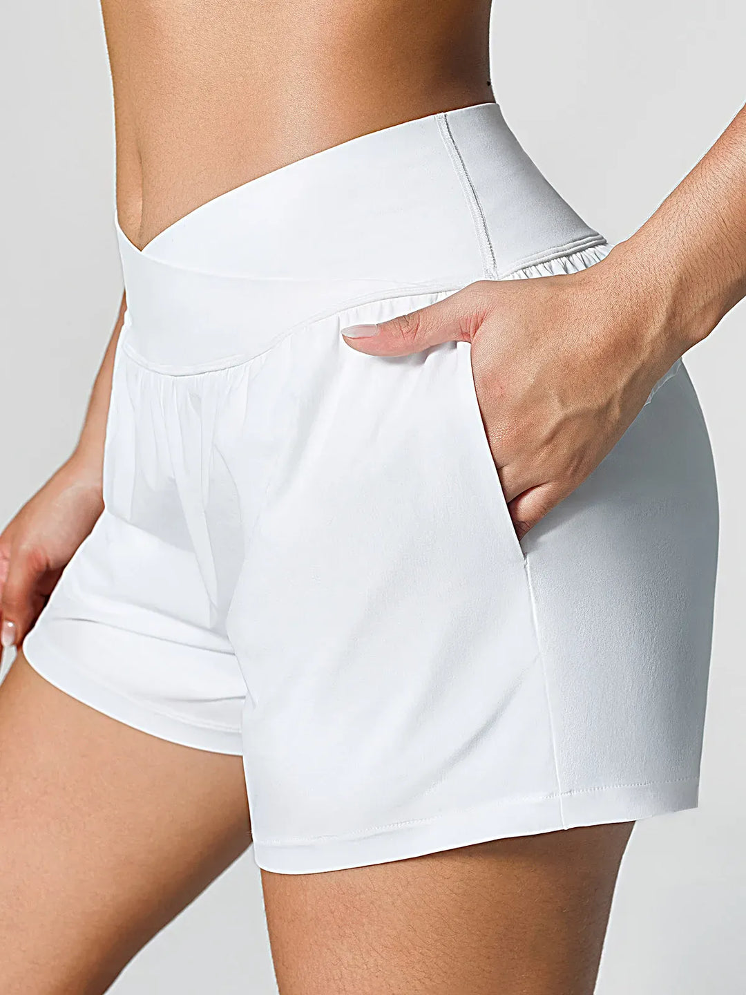 A model wearing a BRXL® Crossover Ruffled Flowy Shorts in