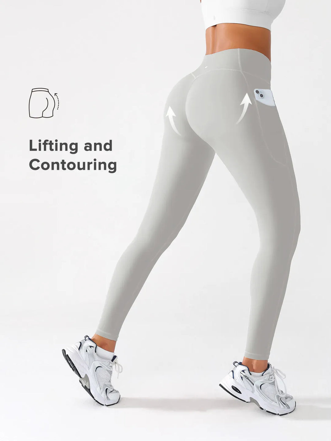 A model wearing a BRXL® Crossover Butt Lifting Side Pockets Running Leggings