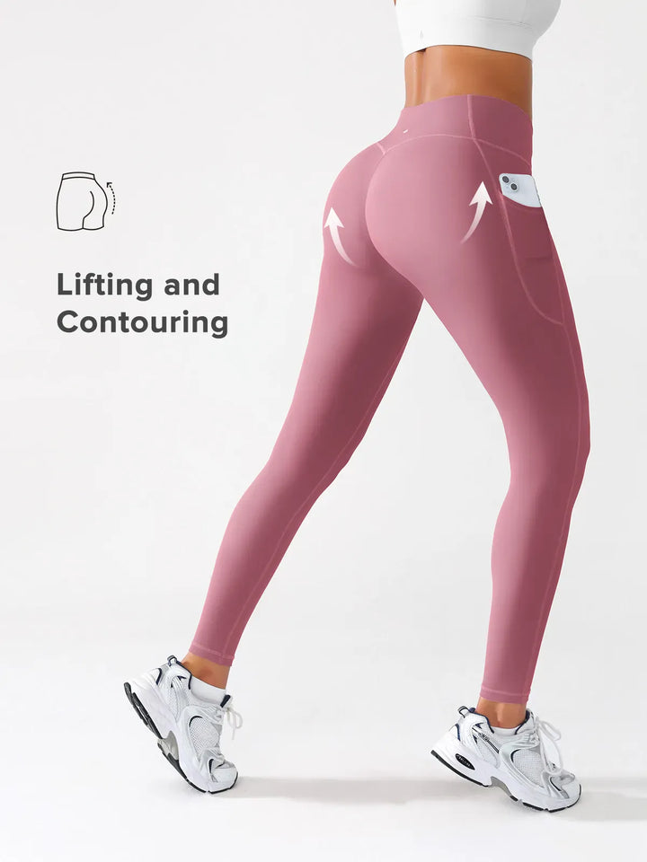 A model wearing a BRXL® Crossover Running Leggings with Pockets in