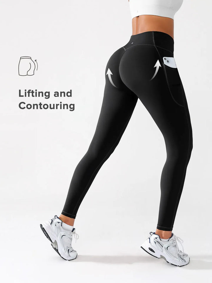 A model wearing a BRXL® Crossover Running Leggings with Pockets in