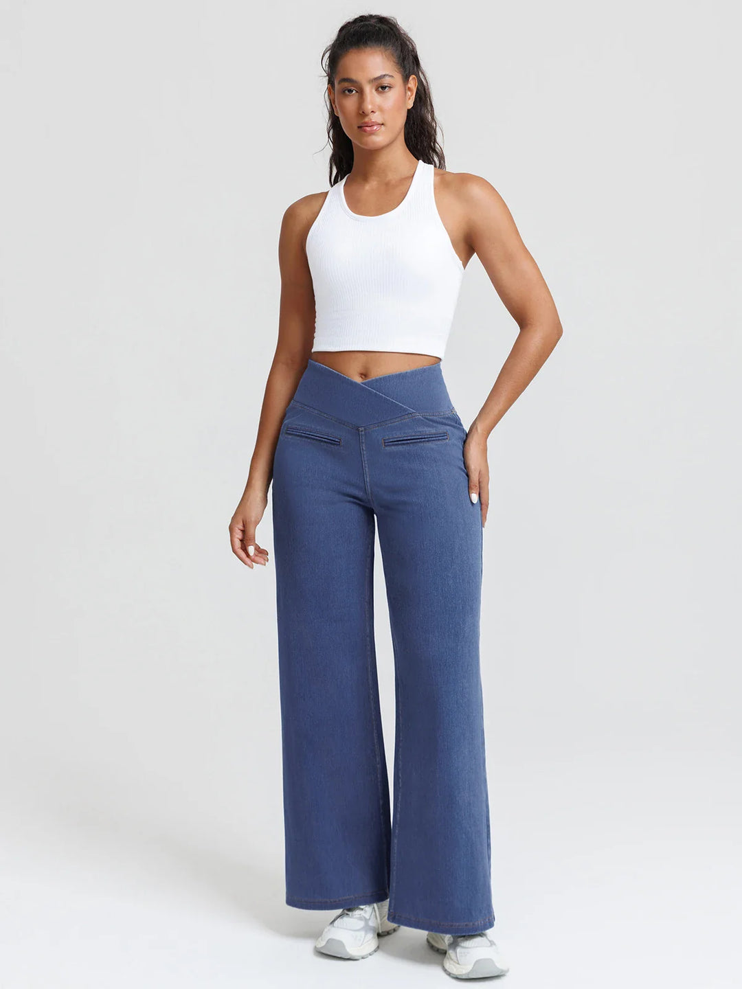 A model wearing a BRXL® Crossover Tummy Control Casual Wide Leg Jeans with Pockets