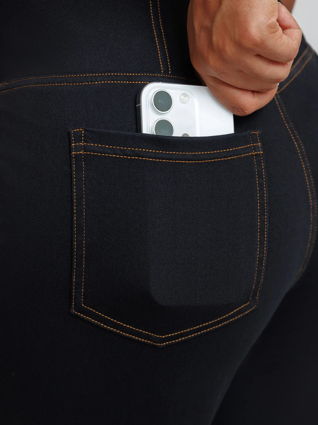 A model wearing a BRXL® Crossover Tummy Control Casual Wide Leg Jeans with Pockets