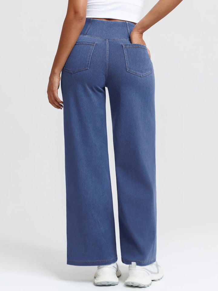 A model wearing a BRXL® Crossover Tummy Control Casual Wide Leg Jeans with Pockets