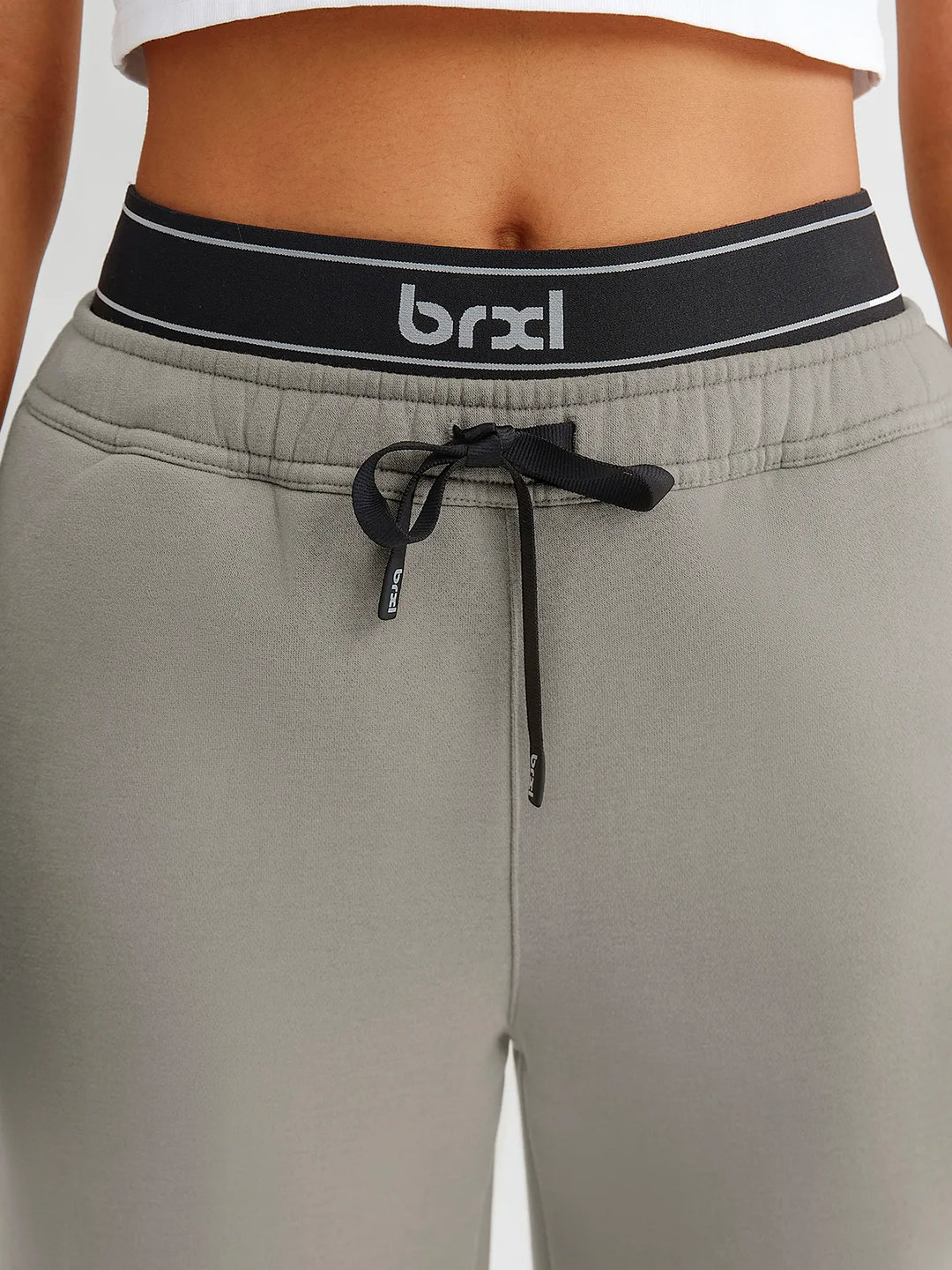 A model wearing a BRXL® Double Waistband Drawstring Mid-Rise Straight-Leg SweatPants