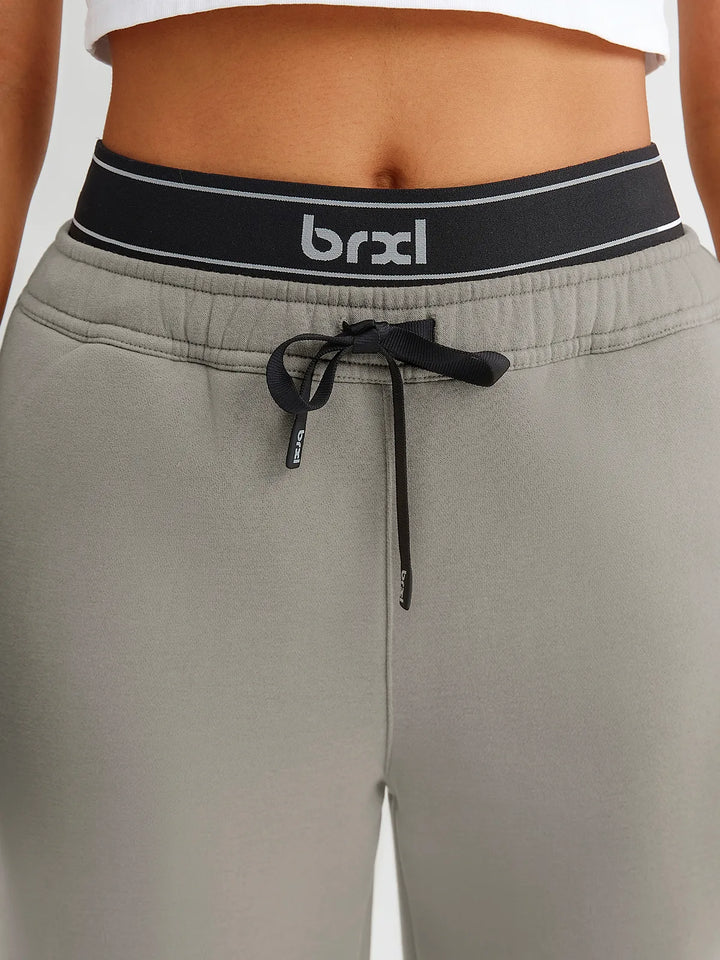 A model wearing a BRXL® Double Waistband Drawstring Mid-Rise Straight-Leg SweatPants