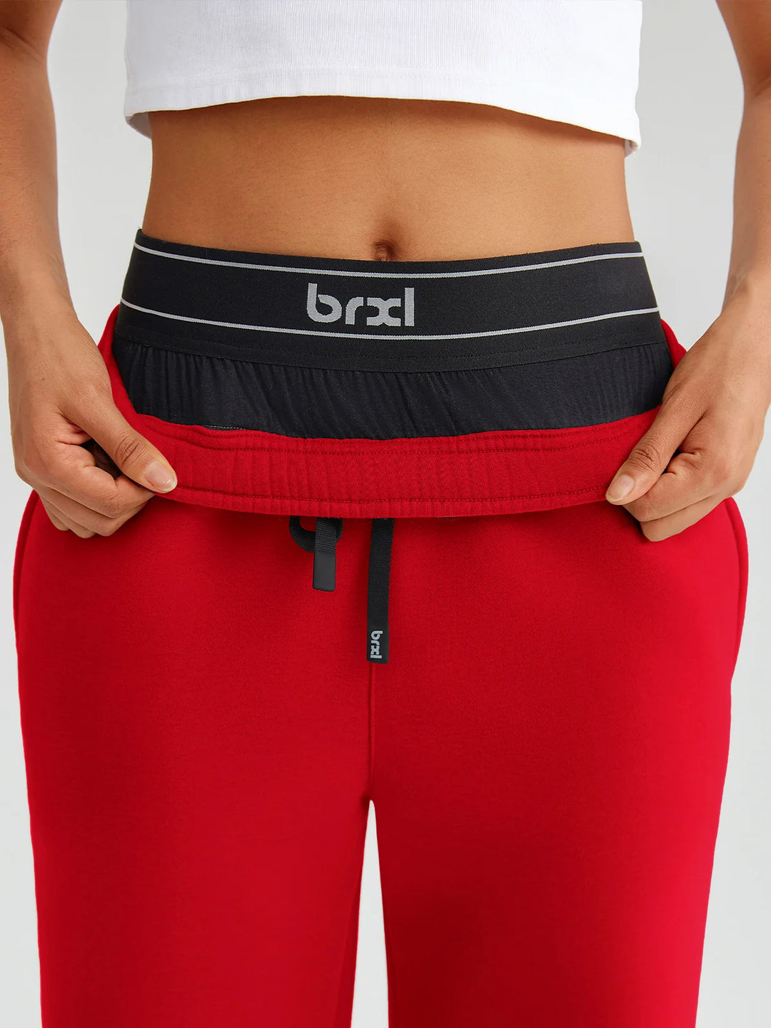 A model wearing a BRXL® Double Waistband Drawstring Mid-Rise Straight-Leg SweatPants