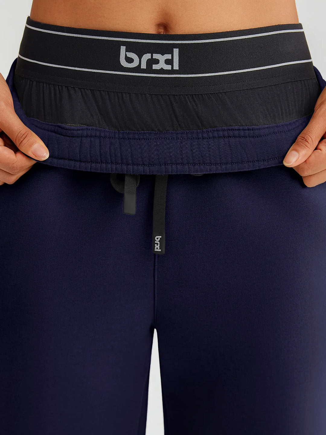 A model wearing a BRXL® Double Waistband Drawstring Mid-Rise Straight-Leg SweatPants