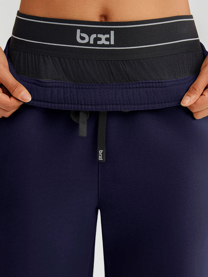 A model wearing a BRXL® Double Waistband Drawstring Mid-Rise Straight-Leg SweatPants