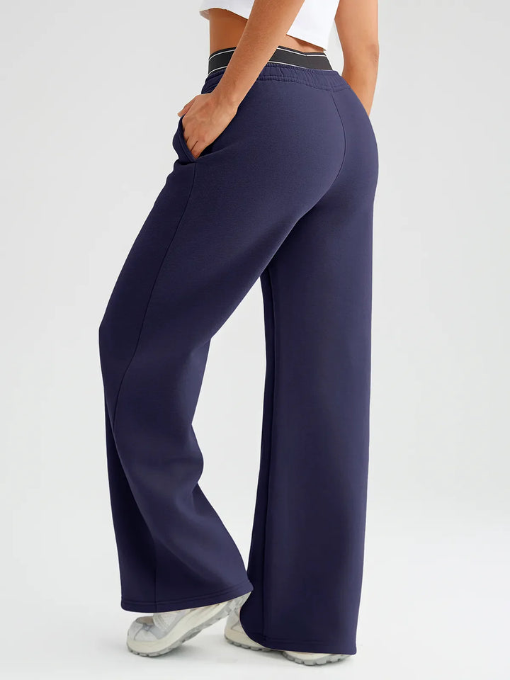 A model wearing a BRXL® Double Waistband Drawstring Mid-Rise Straight-Leg SweatPants