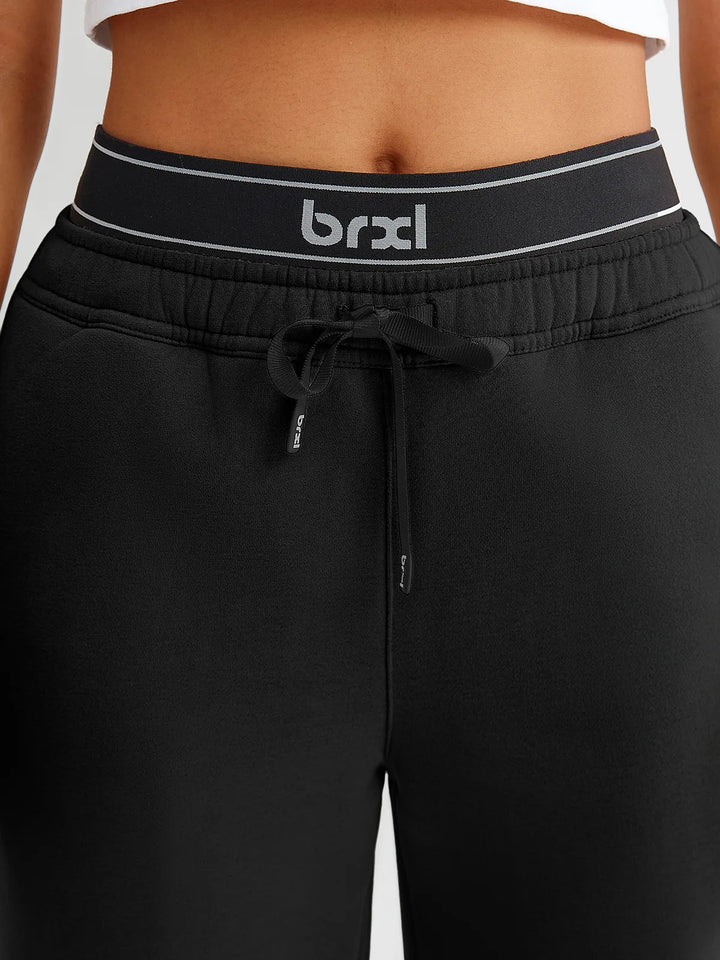 A model wearing a BRXL® Double Waistband Drawstring Mid-Rise Straight-Leg SweatPants