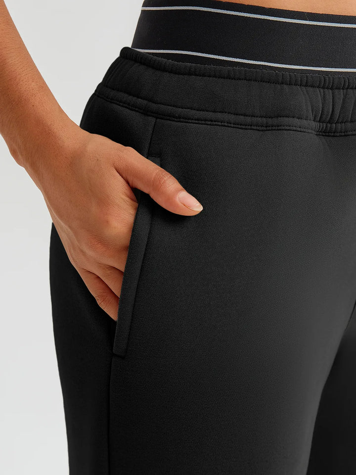 A model wearing a BRXL® Double Waistband Drawstring Mid-Rise Straight-Leg SweatPants
