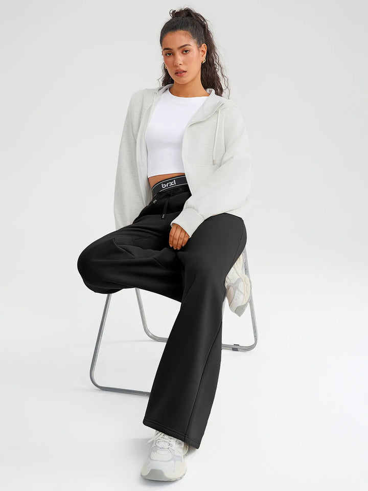 A model wearing a BRXL® Double Waistband Drawstring Mid-Rise Straight-Leg SweatPants