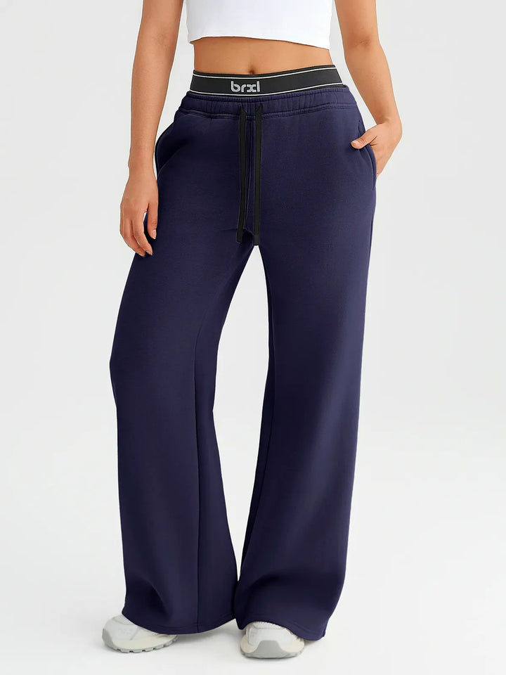 A model wearing a BRXL® Double Waistband Drawstring Mid-Rise Straight-Leg SweatPants Blueberry Blue / XS