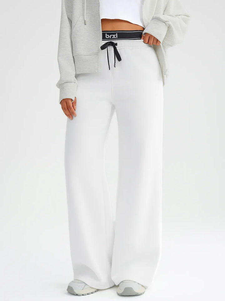 A model wearing a BRXL® Double Waistband Drawstring Mid-Rise Straight-Leg SweatPants White / XS