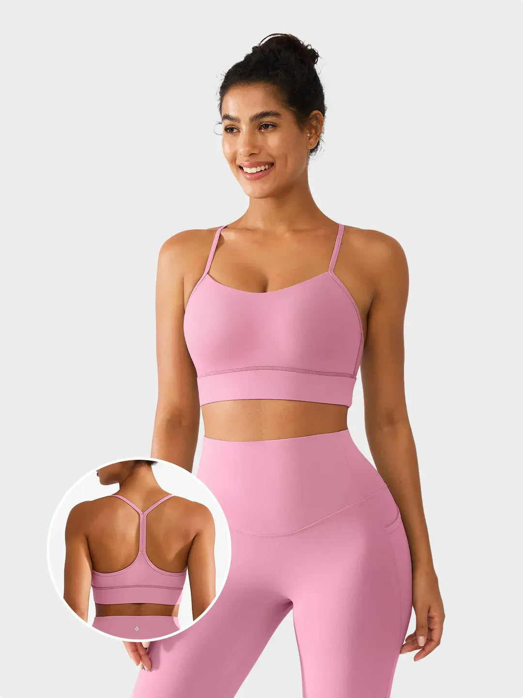 A model wearing a BRXL® Flow Y Racerback Bra with Low Cut and Spaghetti Straps in